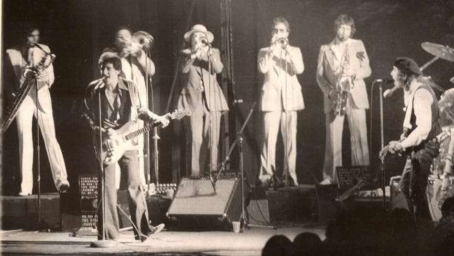 Miami Steve (now Little Stevie) Van Zandt (r) leads the Miami Horns and the Asbury Jukes at the Monmouth Arts Center (now the Count Basie Theatre), Red Bank, in May 1977.