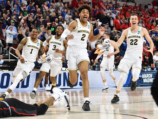 Michigan Wolverines guard Jordan Poole (2) celebrates