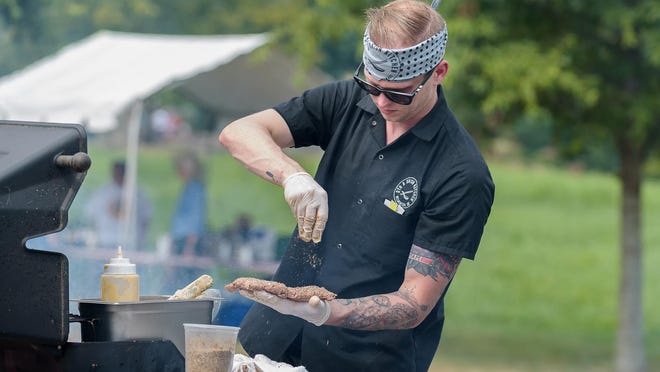 Chef Brian Ashby cookeds up some burgers at 2015 Delaware Burger Battle. This year’s battle takes place at noon Saturday at Cauffiel House, 1016 Philadelphia Pike, Bellevue, across from the Bellevue Mansion