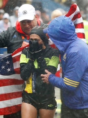 Desiree Linden of the USA reacts to winning the Women's Division of the 2018 Boston Marathon.