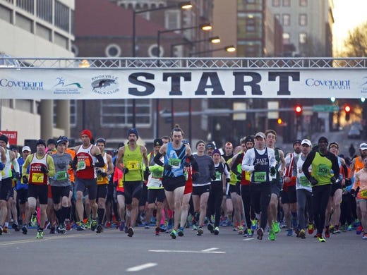 Ethan Coffey (3) leads runners as they cross the Clinch Ave. bridge to start the Covenant Health Knoxville Marathon Sunday, March 29, 2015, in Knoxville, Tenn. Coffey would go on to be the winner. (WADE PAYNE/SPECIAL TO THE NEWS SENTINEL)
