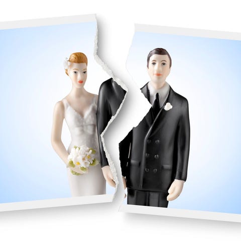 A photograph of a wedding cake topper is torn in h