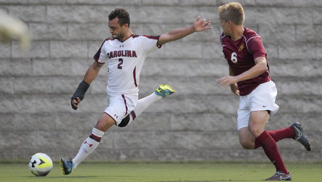 Colerain graduate Kevin Walker, pictured here in 2015 playing for South Carolina, announced Monday that he's signed his first professional soccer contract with Bendigo City FC in Australia. Walker graduated from Colerain in 2012.