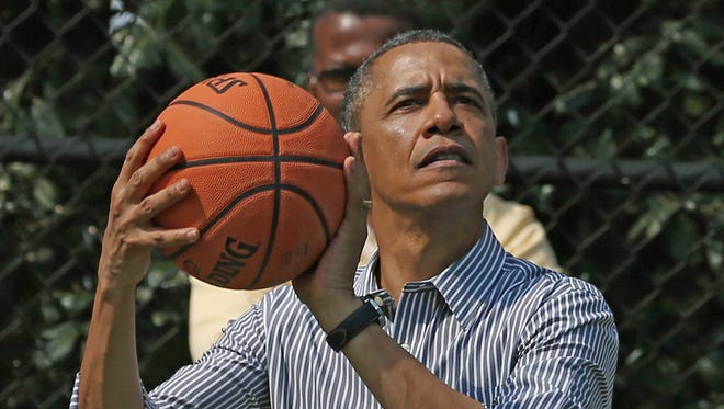 WASHINGTON, DC - APRIL 01:  U.S. President Barack Obama plays basketball during the annual Easter Egg Roll on the White House tennis court April 1, 2013 in Washington, DC. Thousands of people are expected to attend the 134-year-old tradition of rolling colored eggs down the White House lawn that was started by President Rutherford B. Hayes in 1878.  (Photo by Mark Wilson/Getty Images) ORG XMIT: 164247283 ORIG FILE ID: 165188323