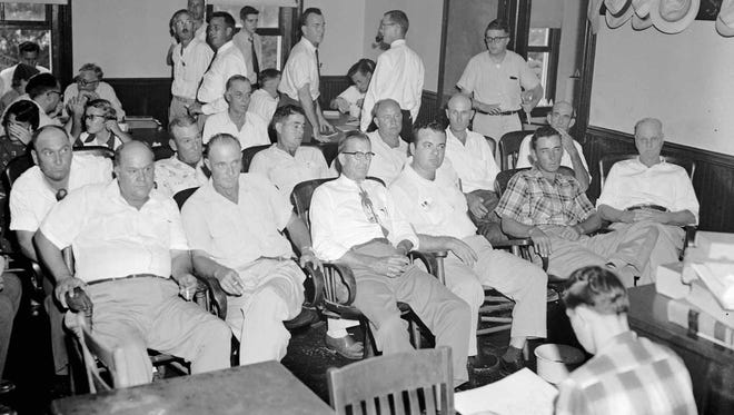 The 12 men in the front rows of the Sumner, Mississippi, courthouse formed the all-white jury that in 1955 acquitted Roy Bryant and JW Milam, accused of the kidnapping and murder of Emmett Till.  Till was a 14-year-old black youth from Chicago who got into deadly trouble while visiting relatives in this rural Mississippi community.