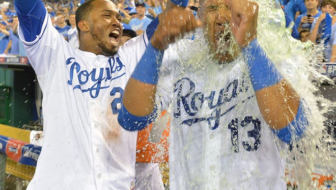 Royals shortstop Alcides Escobar dumps Gatorade on catcher Salvador Perez after Perez hit a walk-off single to defeat the Athletics in the AL wild card playoff game at Kauffman Stadium Tuesday.