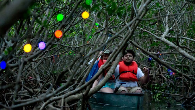 Sunset canoe trips at the Environmental Learning Center in Wabasso are a different way to see holiday lights on the Treasure Coast.