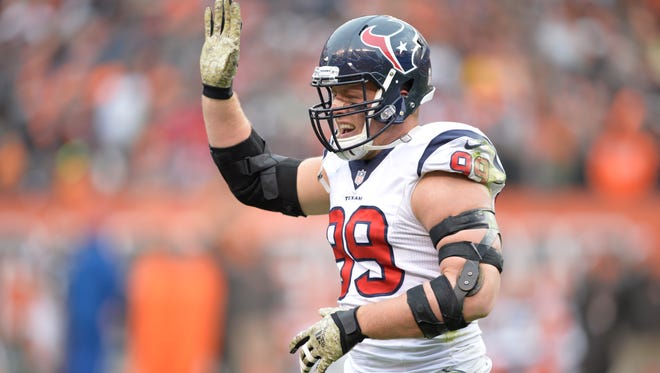 Houston Texans defensive end J.J. Watt celebrates after catching a touchdown pass against the Cleveland Browns on Sunday, Nov. 16, 2014, in Cleveland.