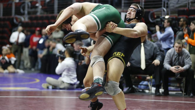 Southeast Polk's Daniel Ramirez lifts up Dubuque-Hempstead's Gannon Gremmel Friday during the Class 3A semifinals at the state wrestling tournament in Des Moines.