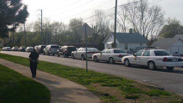 Police responded to a report of a man with a gun barricaded inside a home in the 6400 block of West Morris Street Friday, April 17, 2015.
