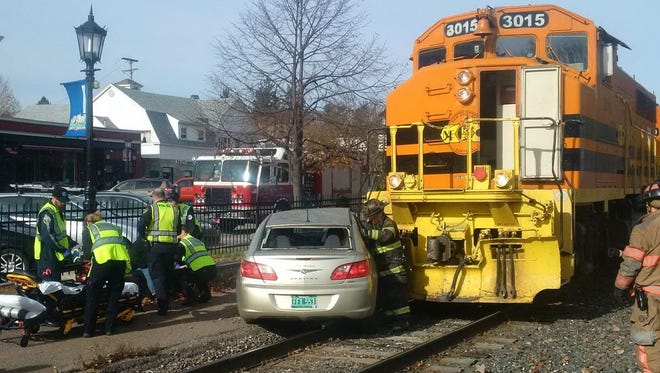 Emergency crews respond to a crash between a car and train Thursday morning in Essex Junction.