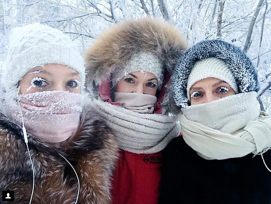 Anastasia Gruzdeva, left, poses for a selfie with her friends on Jan. 13, 2018, as the temperature dropped to about 58 degrees below zero in Yakutsk, Russia.