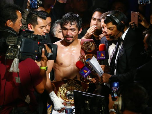 Manny Pacquiao speaks with media following his victory