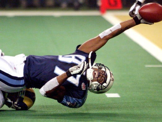 Super Bowl XXXIV (Rams 23, Titans 16): Titans wide receiver Kevin Dyson tries to stretch across the goal line on the final play of the game. He is stopped by Rams linebacker Mike Jones.