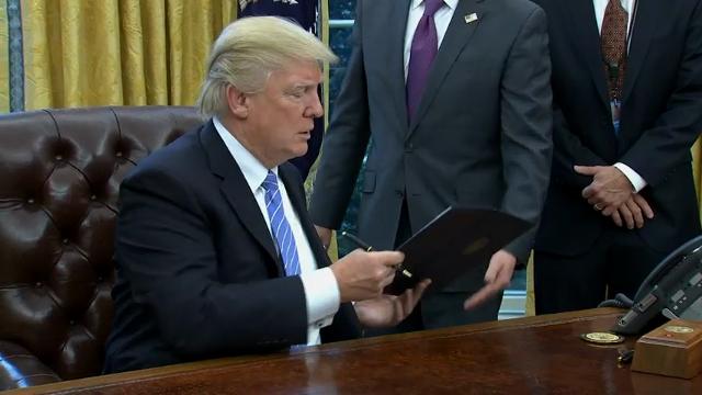Trump signs 3 executive orders, pulls out of TPP