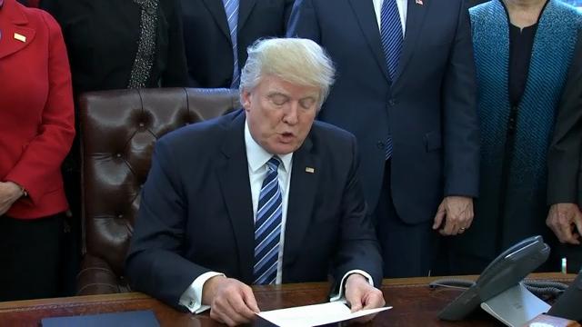 Trump signs order to streamline executive branch