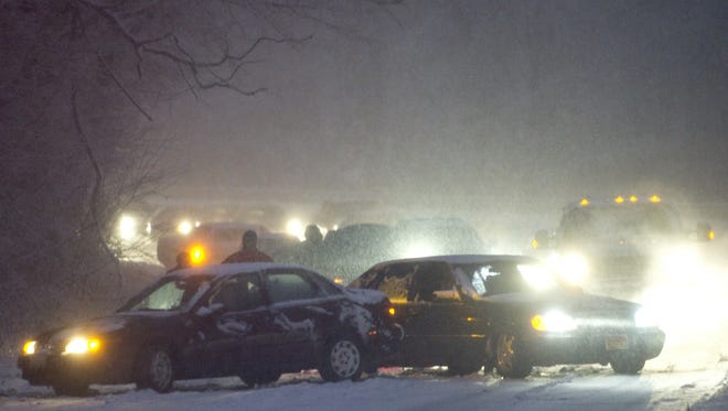 A car accident blocks traffic along Suitland Parkway during a snowstorm in Washington, D.C., on Jan. 26, 2011.