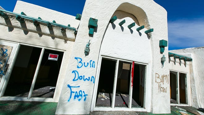 Graffiti on the exterior of the former Las Cruces Country Club reads, "Burn Down Fast," and "Burn Now," on Monday where two separate fires broke out at the location in the evening hours on Friday, Jan. 22. The first fire was a brush fire located near the building, the second blaze gutted the former clubhouse.
