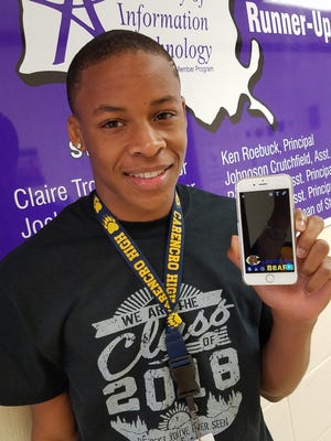 Tyran Scott, a junior at Carencro High, shows the Snapchat filter he made for the school.