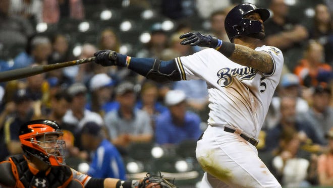 Brewers second baseman Jonathan Villar  hits a solo home run in the seventh inning at Miller Park.