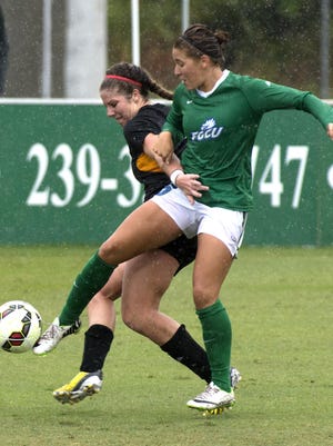 FGCU Eagles Tabby Tindell ,left , and Kenneshaw Stae Owls fight for the ball during the 2014 Atlantic Sun Women's Soccer Championship game, Sunday (11/9/14) at FGCU. FGCU beat Kennesaw State 3-1 to win the championship.