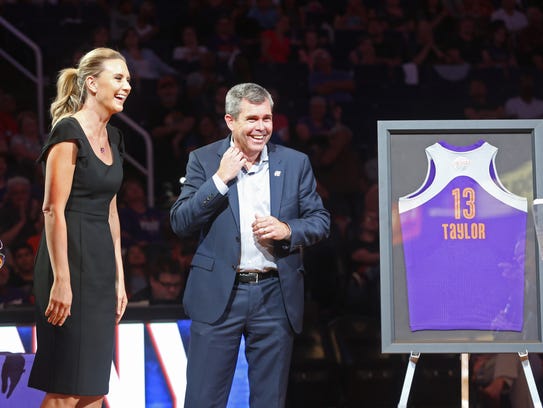 Mercury executive Jim Pitman presents a retired jersey