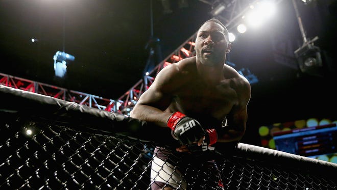 NEWARK, NJ - JANUARY 30:  Anthony Johnson of the United States  celebrates his win by TKO against Ryan Bader (not pictured) of the United States in the first round of their light heavyweight bout during the UFC Fight Night event at the Prudential Center on January 30, 2016 in Newark, New Jersey.  (Photo by Elsa/Getty Images)