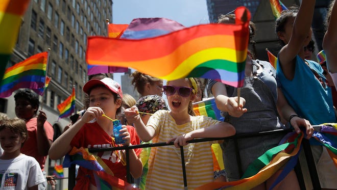 Children blow bubbles on a float at the Pride Parade in New York on  June 29.