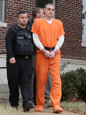 Zachary Adams is escorted out of the Decatur County Courthouse after appearing before Judge C. Creed McGinley for a motions hearing in Decaturville, Tenn., on Wednesday, Dec. 14, 2016.