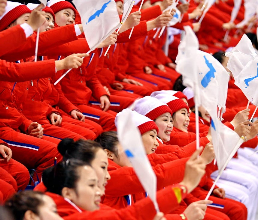 North Korea cheerleaders root for the unified Korea women's ice hockey team in the Pyeongchang 2018 Olympic Winter Games at Kwandong Hockey Centre.