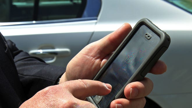 Uber driver Rick Thul of North Plainfield gets his assignments on his phone app.