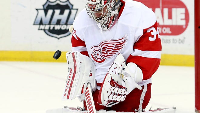 Red Wings goalie Petr Mrazek (34) makes a save during the second period of the Wings' 3-1 loss Wednesday in Tampa Bay.