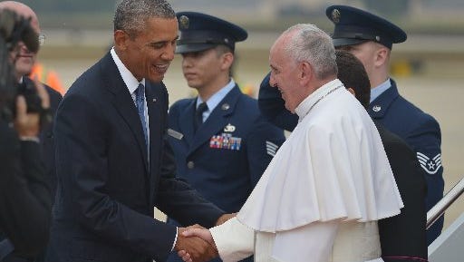 President Barack Obama greets Pope Francis