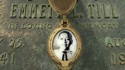 FILE - In this May 4, 2005 file photo, Emmett Till's photo is seen on his grave marker  in Alsip, Ill. The FBI announced Wednesday, May 4, 2005, that Till's body will be exhumed to conduct an autopsy, which was never performed, and determine the cause of death. The woman at the center of the trial of Emmett Till's alleged killers has acknowledged that she falsely testified he made physical and verbal threats, according to a new book. Historian Timothy B. Tyson told The Associated Press on Saturday, Jan. 28, 2017,  that Carolyn Donham broke her long public silence in an interview with him in 2008.
