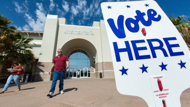 Voters enter and exit the Doña Ana County Government Center on Monday May 30, 2016, during the first time the county offers early voting on Memorial Day.