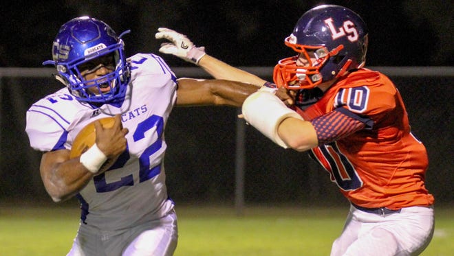 PCS running back Isaiah Woullard carries the ball against a Lamar Friday night in Meridian.