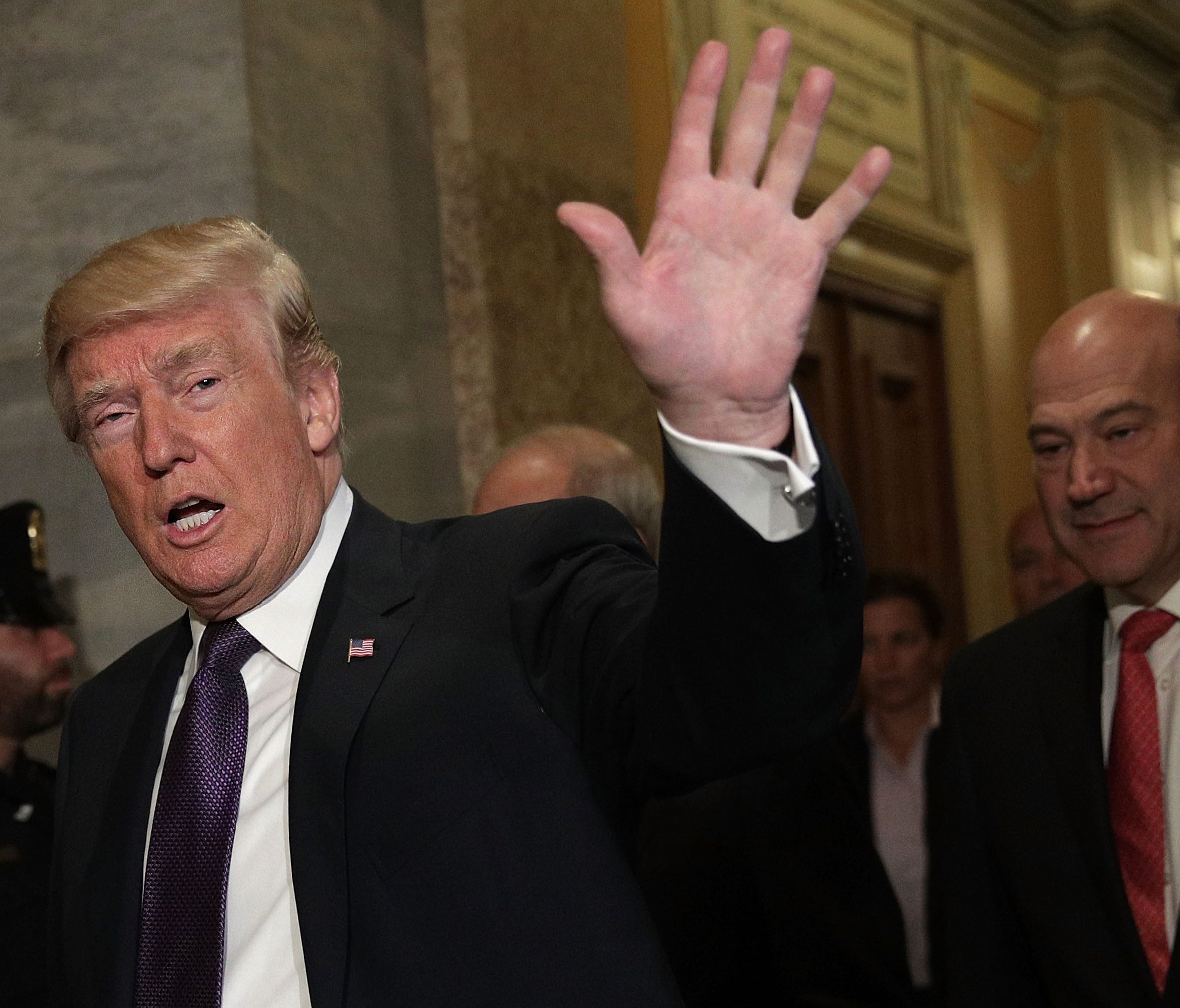 President Trump waves as he arrives for a House Republican Conference meeting in Washington D.C.
