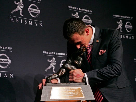 Dec. 8, 2012: Johnny Manziel kisses the Heisman Trophy