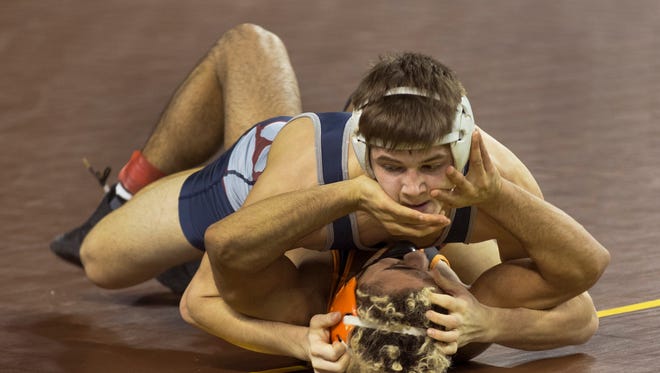 Lacey's Luke Gauthier (top) pins Hackettstown's Alex Carida in a 145-pound quarterfinal-round bout Saturday afternoon in the NJSIAA Individual Championships at Boardwalk Hall, Atlantic City .