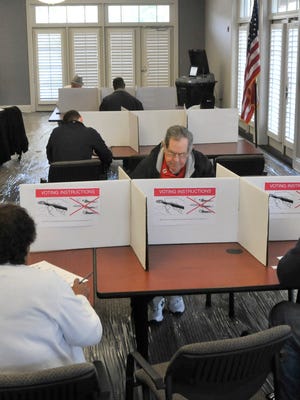 Voters fill out their ballot.