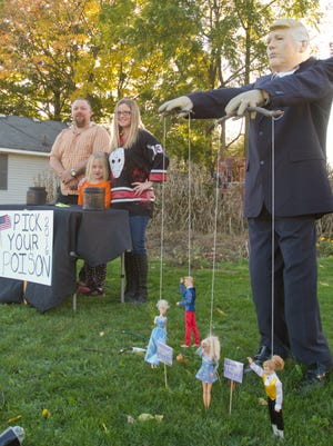 Charles and Jessica Erisman and their 6-year-old daughter, Amelia, think the scariest thing about this fall season is the candidates we have for the upcoming presidential election, depicting Hillary Clinton as a scary witch and Donald Trump as a zombie puppetmaster. They've gotten quite a bit of attention from their Halloween display in their home in the 300 block of Livingston Street in Howell.
