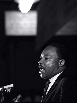 In this April 3, 1968 file photo, the Rev. Martin Luther King Jr. makes his last public appearance at the Mason Temple in Memphis, Tenn. The following day King was assassinated on his motel balcony.