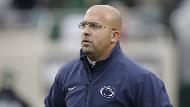 Penn State head coach James Franklin runs onto the field before an NCAA college football game against Michigan State, Saturday, Nov. 4, 2017, in East Lansing, Mich. (AP Photo/Carlos Osorio) ORG XMIT: otkco107
