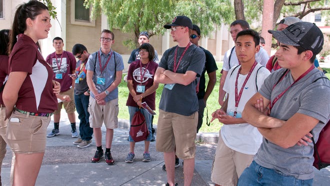 NMSU orientation leader Jennifer Hughes conducts a question and answer session with her orientation group Saturday afternoon on NMSU's campus, 6/11/16