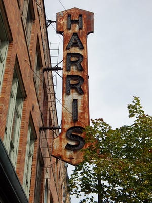 A sign for The Harris Sample Furniture Company still stands outside the Harris Building  on Sept. 15, 2015 in Grand Rapids. The Harris Building will open with an exhibition for ArtPrize 2015 and soon will launch a new Arts and Social Club in the Heartside Neighborhood downtown.