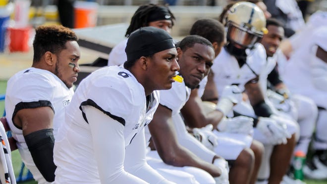 Purdue wide receiver Myles Norwood, front, and his teammates watch in the final minutes of Purdue's 24-7 loss to Wisconsin, Oct. 17, 2015, in Madison, Wis.