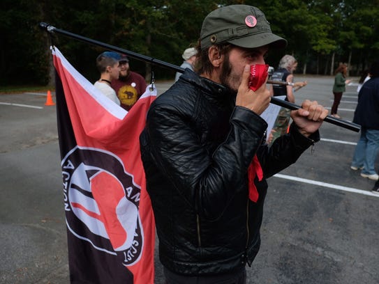 A protester representing Antifa joined a group protesting