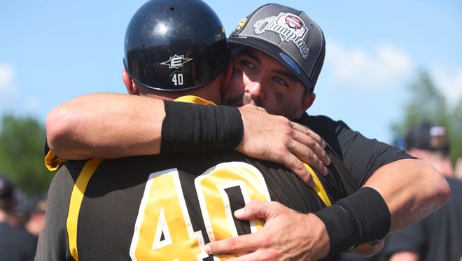 Southern Miss senior Tim Lynch hugs coach Scott Berry after the Golden Eagles won the Conference USA tournament championship on Sunday.