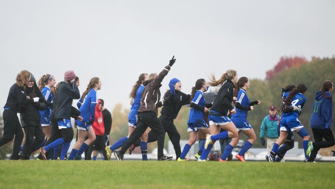 Colchester celebrates the game-winning goal in double overtime during a high school girls soccer game against Saturday.