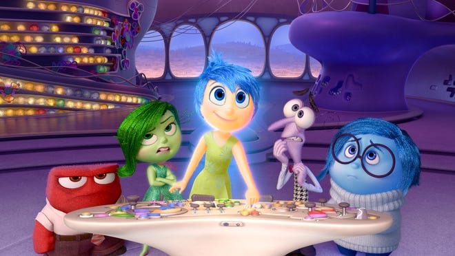 Anger, voiced by Lewis Black, Disgust, voiced by Mindy Kaling, Joy, voiced by Amy Poehler, Fear, voiced by Bill Hader, and Sadness, voiced by Phyllis Smith appear in a scene from “Inside Out.”
